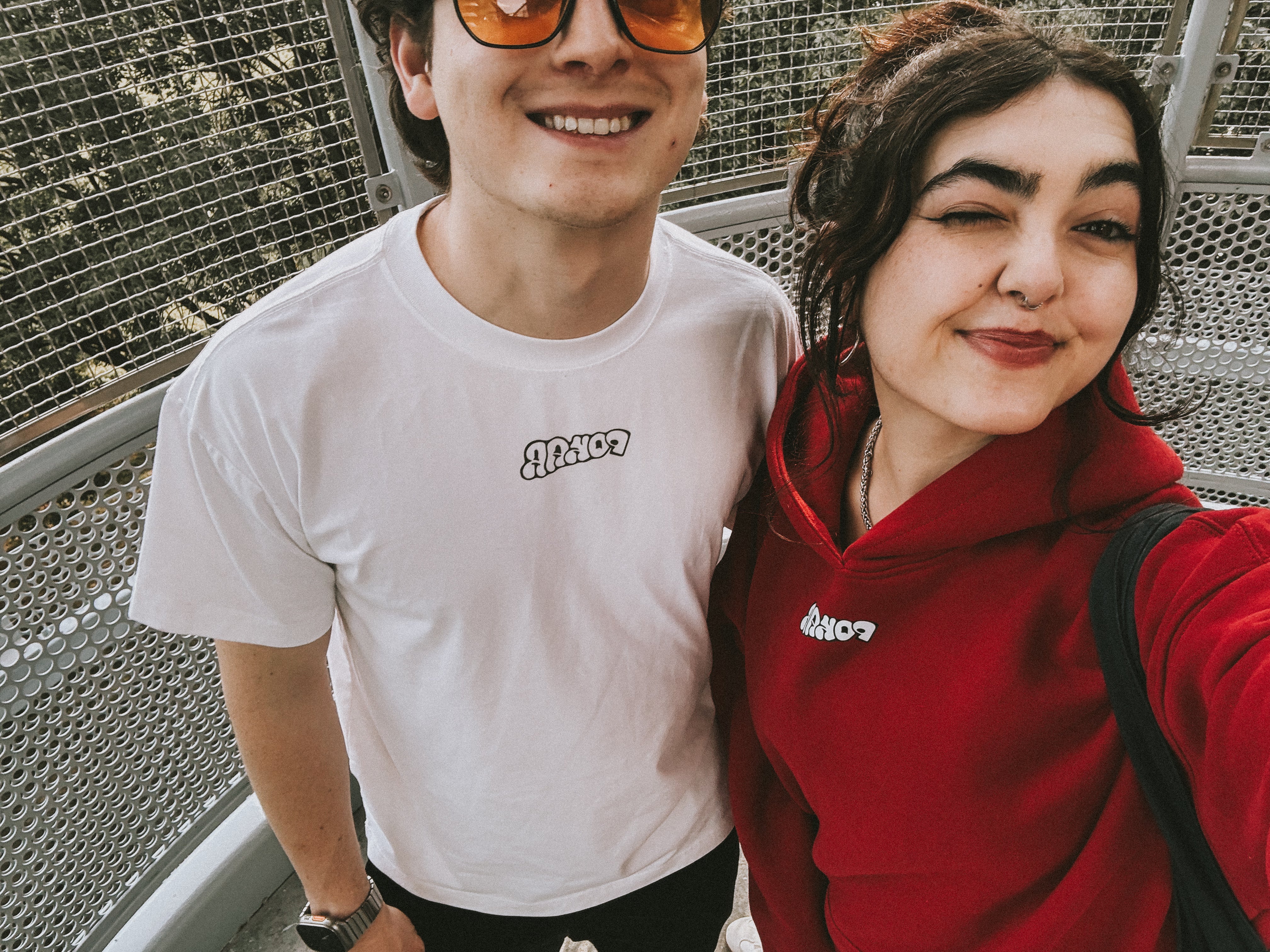 Friends wearing POKAR tees and hoodies