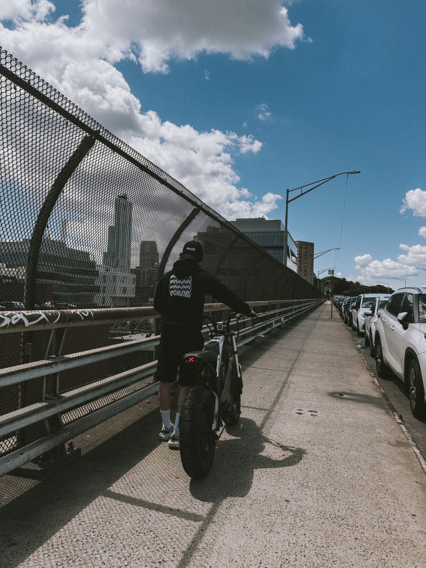POKAR rider crossing a New York bridge